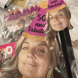 party supplies featuring a woman wearing a party hat that says "50 and fabulous!"