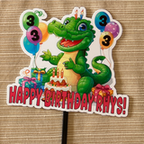 green alligator with a birthday cake and balloons on a black stick with a brown background