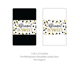 visual of a 1.56 x 2.5 inch chocolate bar wrapper sticker that says "Retirement is sweet" on a white background with black and gold confetti