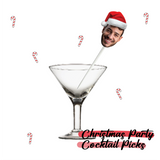 Martini glass with a straw and candy cane decorations, featuring a person's face in a Santa hat with 'Christmas Party Cocktail Picks' text.
