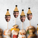 Mushroom skewers with faces on top against a textured white background