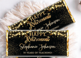 a chocolate bar wrapper with gold lights and confetti on it reading "Happy Retirement Stephanie"