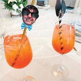 straws with pictures of a man and dog in wine glasses