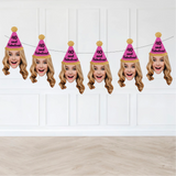 blond woman wearing a pink party hat that says "40 and fabulous!" hanging on a strung banner against a wall