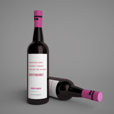 Wine bottle with humorous label on a gray background "tastes like I dont have to go to work anymore!"
