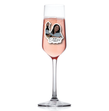 Champagne flute with a decorative sticker on a white background