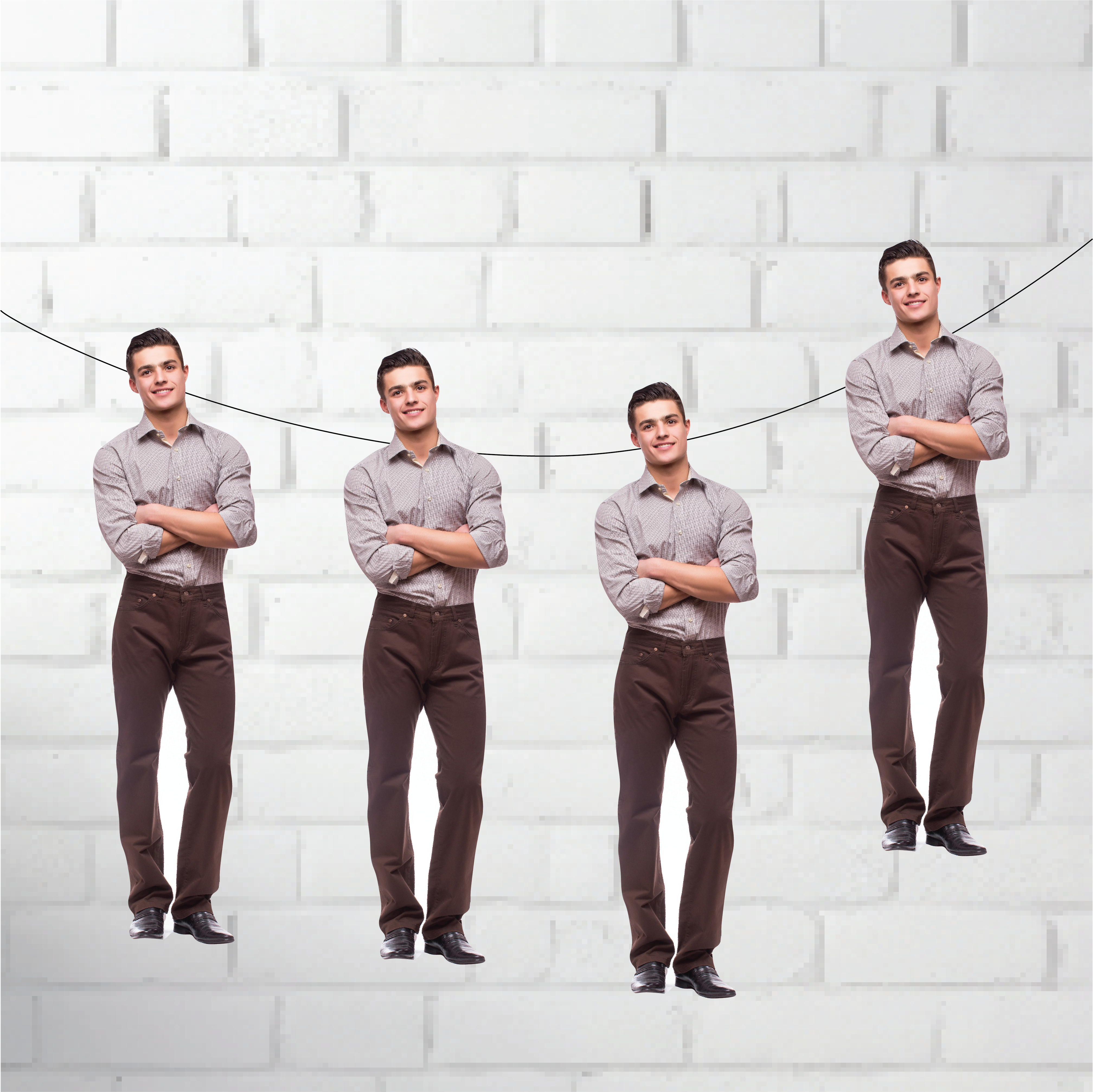 Four identical men standing against a white brick wall.