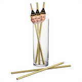 A set of custom retirement party photo straws with gold foil ends, featuring photos of three men's faces on the straws, placed in a clear glass.
