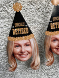 blond woman wearing a black and gold party hat that reads "Officially Retired" strung on a banner