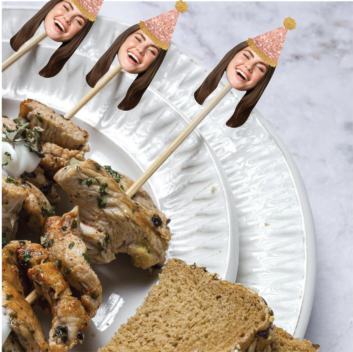 Skewers with food on a plate with decorative face sticks.