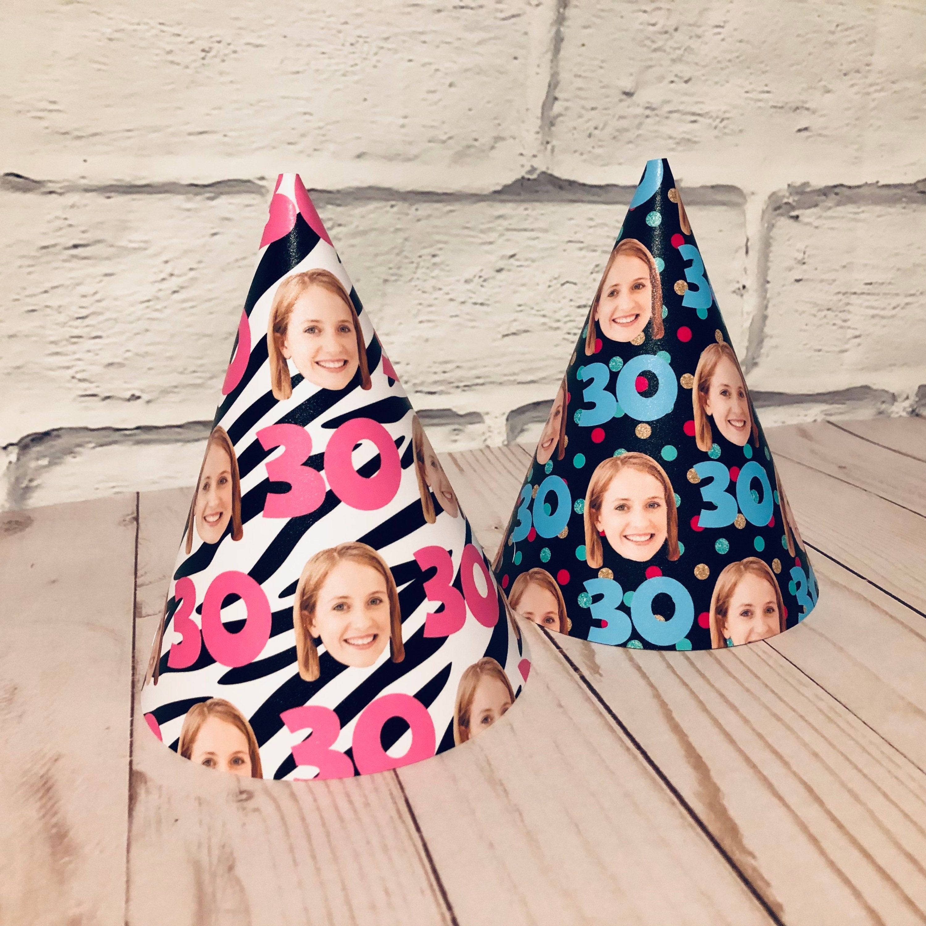 2 different patterned party hats with a womans face cut out and the #30