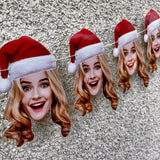 blond woman wearing a santa hat strung on a banner