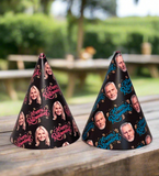 2 different style black happy retirement party hats with text and face cut outs